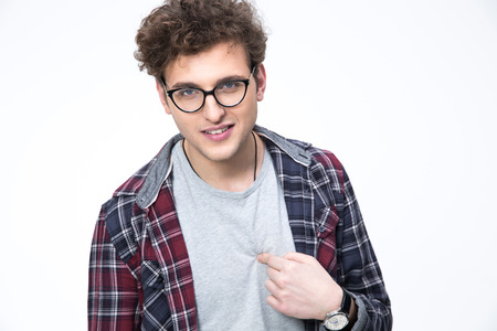 Young man in glasses pointing at himselfの写真素材