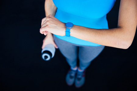 Woman with activity tracker and shakerの写真素材