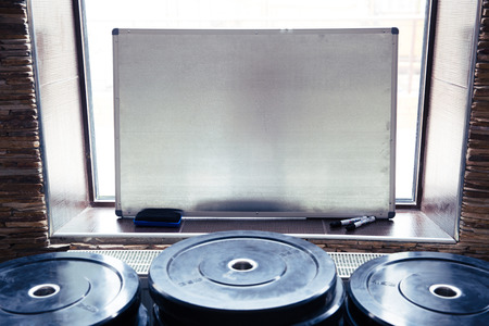 Closeup image of a clipboard in fitness gymの写真素材