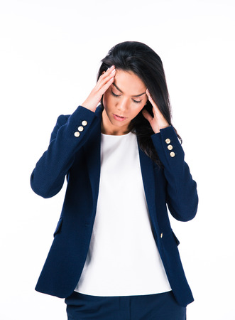 Portrait of a businesswoman with headache isolated on a white backgroundの写真素材