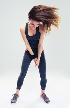 Crazy woman posing over gray backgroundの写真素材