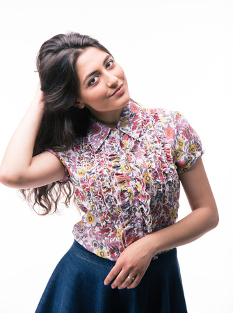 Happy young woman isolated on a white background. Looking at cameraの写真素材