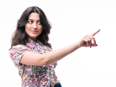 Cute woman pointing finger away isolated on a white backgroundの写真素材
