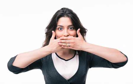 Young businesswoman covering her mouth with hands isolated on a white background