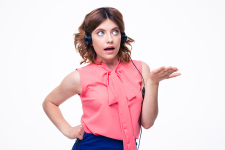 Portrait of shocked female customer operator isolated on a white backgroundの写真素材