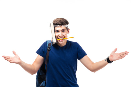 Funny young male student with book and pencil strapped to his head isolated on a white backgroundの写真素材