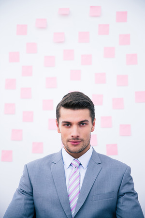 Portrait of a young confident businessman looking at cameraの写真素材