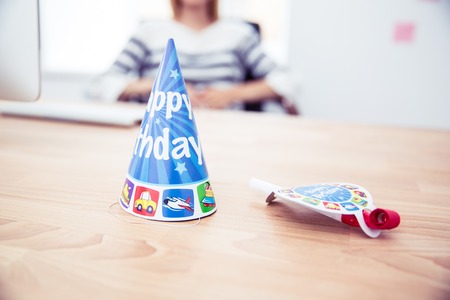 Closeup portrait of a birthday hat and whistleの写真素材