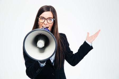 Businesswoman shouting in megaphone isolated on a white backgroundの写真素材