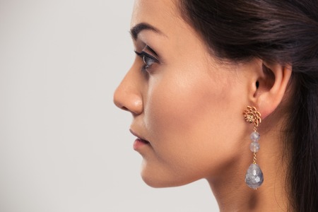 Side view portrait of a beautiful woman isolated on a white background