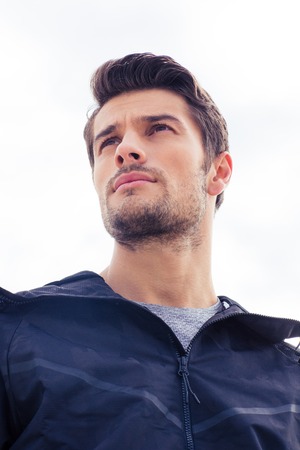 Portrait of a handsome young man standing isolated on a white backgroundの写真素材