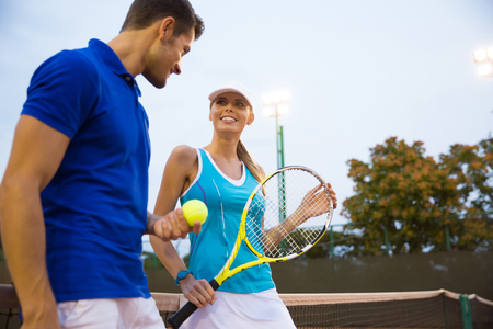 Portrait of a two tennis player talking outdoorsの写真素材