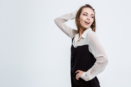 Portrait of a happy cute businesswoman looking away isolated on a white backgroundの写真素材