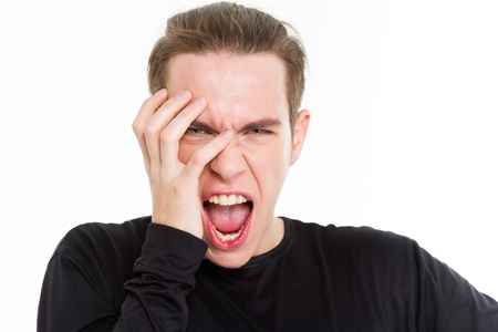 Portrait of a crazy man looking at camera isolated on a white backgroundの写真素材