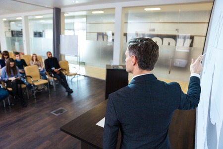 Back view of intelligent speaker on business conference in meeting hallの写真素材