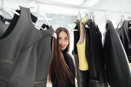 Smiling woman shopping in a clothing store