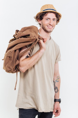 Portrait of a happy casual man looking at camera isolated on a white backgroundの写真素材