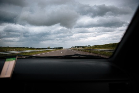 View from windshield of car driving on the roadの写真素材