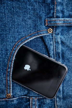 Smartphone with blank screen in jeans pocketの写真素材