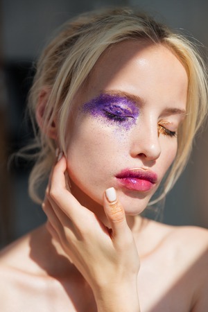 Sensual beautiful young woman with bright stylish makeup and eyes closedの写真素材