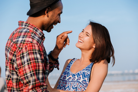 Happy young couple laughing and having fun outdoorsの写真素材