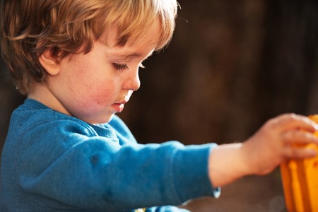 Boy in profile on blur background. close up portraitの写真素材