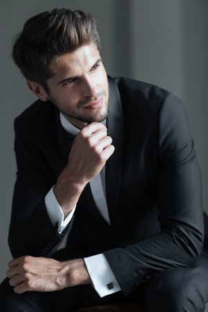 Portrait of model in suit. looking away