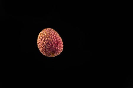 Ripe fresh lychee fruit isolated on black backgroundの写真素材
