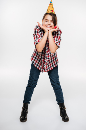 Image of happy young birthday girl posing isolated over white background.の写真素材