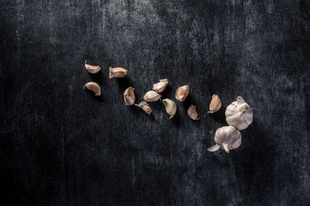 Top view photo of a garlic over dark backgroundの写真素材