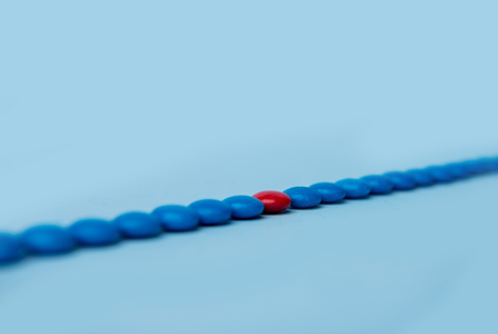 Picture of a lot of colorful sweeties candy over blue table background.の写真素材