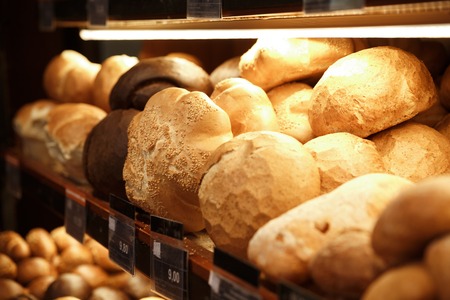 Picture of a lot of bread and pastries in supermarket bakery