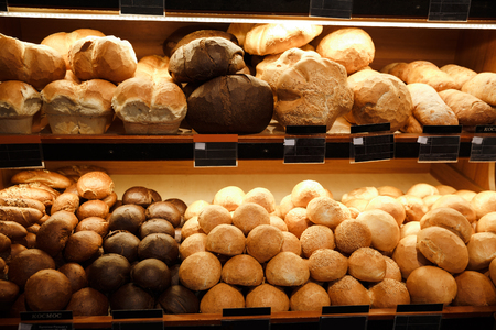 Picture of a lot of bread and pastries in supermarket bakeryの写真素材
