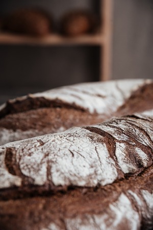 Cropped photo of bread with flour at bakery