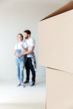 Close up of boxes in new home of lovers isolated