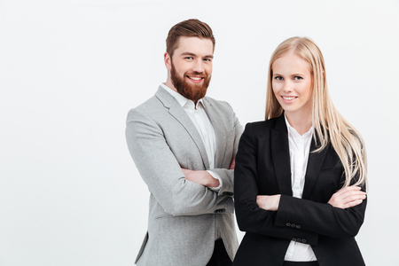 Picture of happy colleagues business team standing over white background isolated. Looking at camera.の写真素材