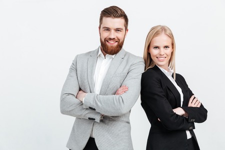 Picture of happy colleagues business team standing over white background isolated. Looking at camera.の写真素材