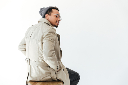 Photo of handsome young african man isolated over white background. Looking aside.の写真素材