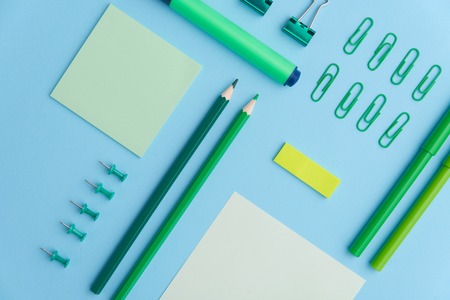 Image of office supplies on the blue background tableの写真素材