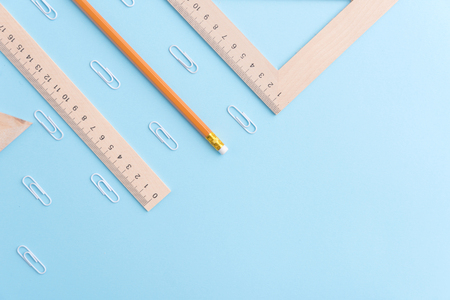 Photo of office supplies on the blue background table