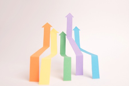 Photo of business graphics arrows isolated over white background.の写真素材