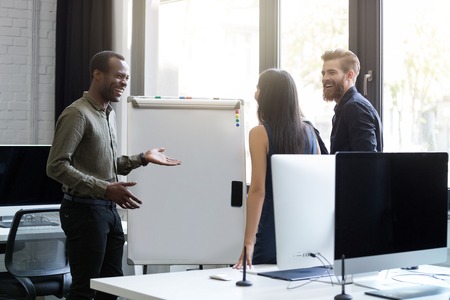 Business people having a board meeting and discussing new ideas in an officeの写真素材