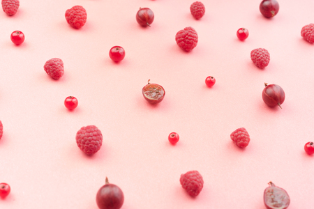 Top View Picture of mix of berries isolated over pink background table.の写真素材