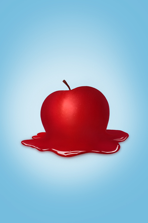 Red delicious apple isolated on blue backgroundの写真素材