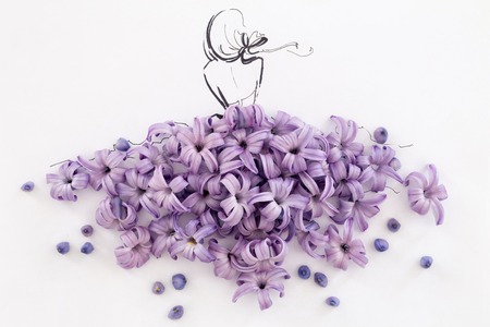 Back view of a hand drawn female silhouette wearing dress made of natural blooming purple hyacinth flowers isolated over white. Fashion illustrationの写真素材