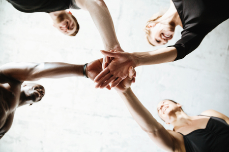 Picture of group of sports strong people standing in gym. Looking aside.の写真素材