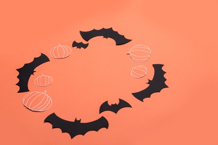 Traditional haloween symbols of black bats and pumpkins on red background. Haloween picture and frame for logoの写真素材