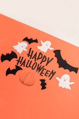 Black typeface phrase for halloween logo with traditional symbols handwritten on orange backgroundの写真素材