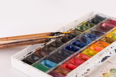 Image of colorful paint buckets and brushes isolated over white backgroundの写真素材