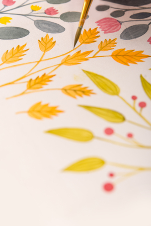 Close up of different colorful flowers nature design painted with brush and watercolors on paperの写真素材